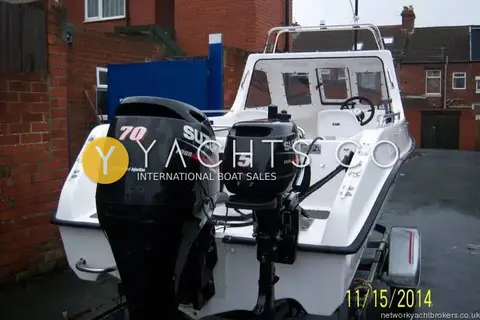 Predator 165: stern view showing Suzuki 70 main outboard beside Suzuki 5 auxiliary