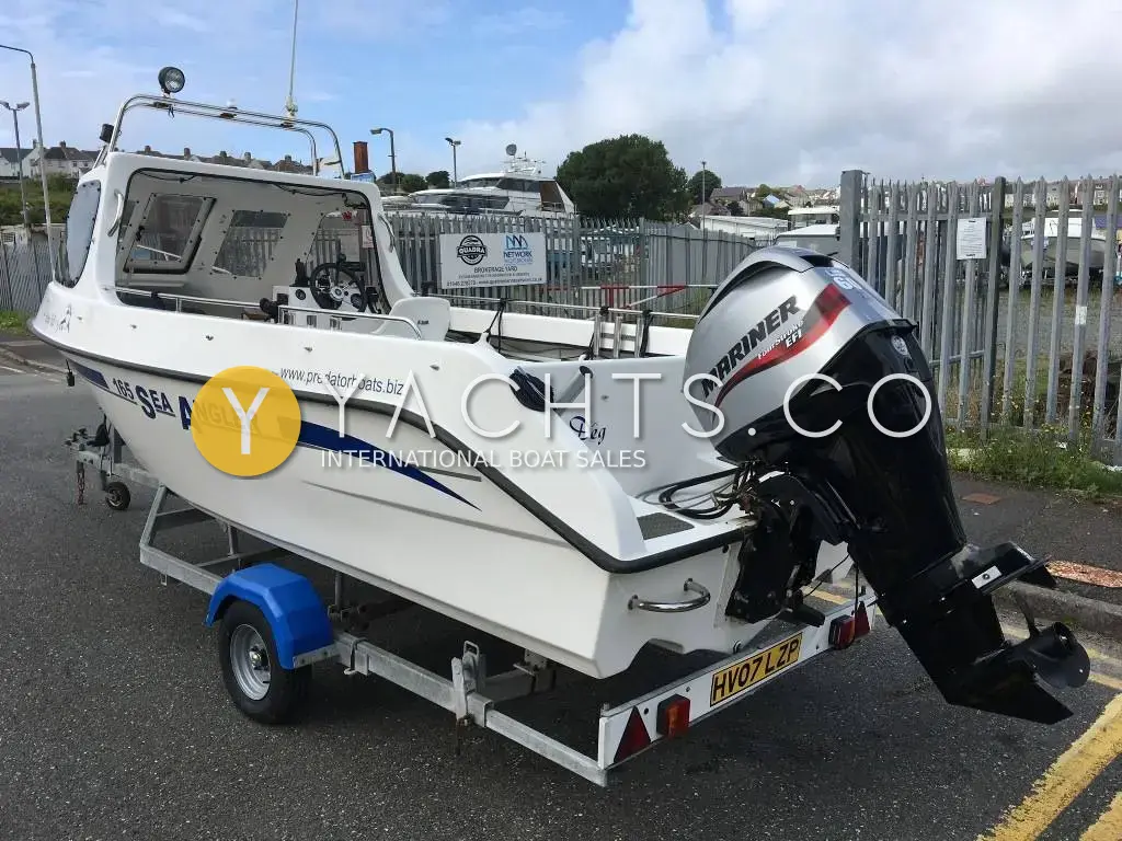 Predator Boats Predator 165 Sea Angler: starboard quarter view on road trailer showing Mariner 60hp EFI outboard and small cuddy