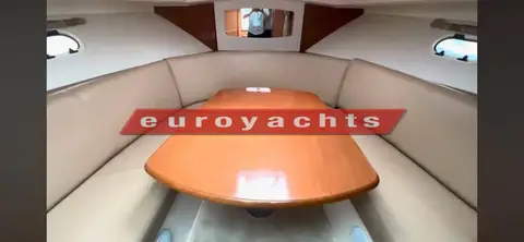 Prestige 30S: saloon dinette with cream upholstered seating around an oval wooden table