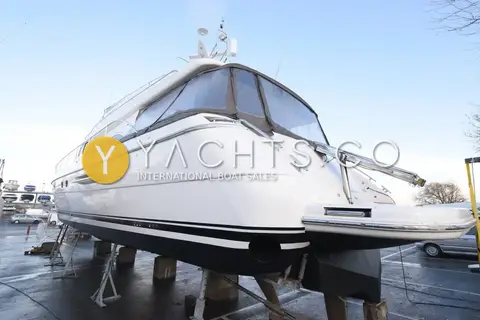 Princess 65: stern quarter view of the white hull and bathing platform ashore on stands