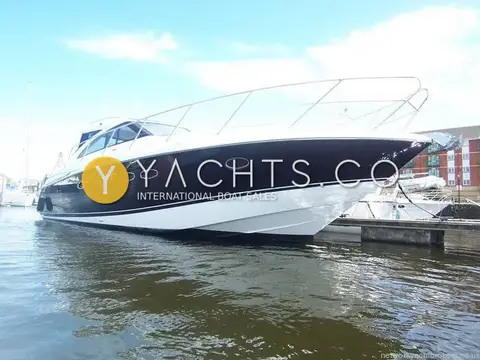 Princess V45: starboard bow view of the dark blue hull and white superstructure alongside a pontoon