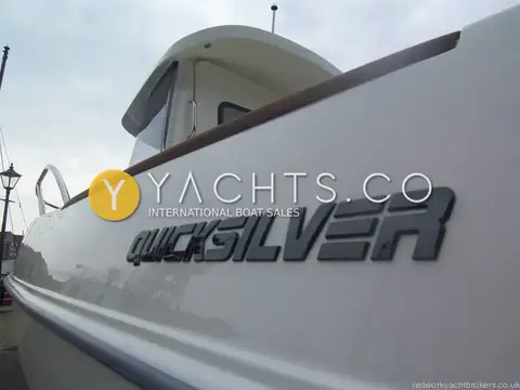 Quicksilver 500 Pilothouse: close-up of hull side lettering below the wooden gunwale capping