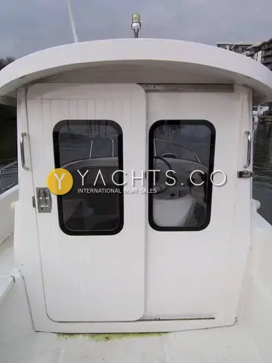 Quicksilver 500 Pilothouse: pilothouse rear sliding doors with windows, seen from the aft deck