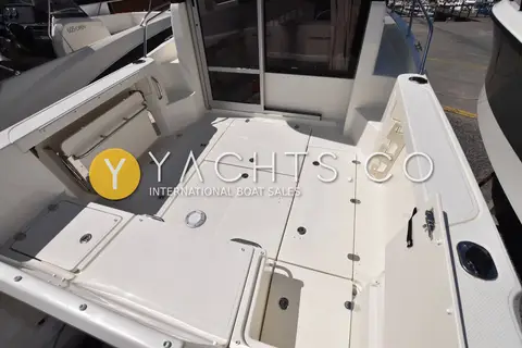 Quicksilver 605 Pilothouse - Smart Edition: cockpit floor hatches looking forward towards the pilothouse sliding door