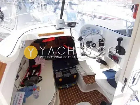 Quicksilver 640 Pilothouse: wheelhouse interior with helm, gauges, VHF radio and berth area with stowed gear