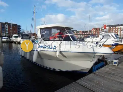 Quicksilver 640 Pilothouse: starboard side of white pilothouse hull with blue name lettering, moored in Swansea marina