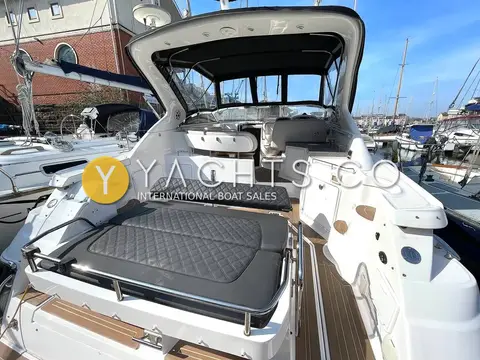 Regal 3760: aft sunpad with grey quilted cushions looking forward to the cockpit and windscreen