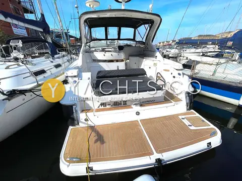Regal 3760: stern view showing teak bathing platform, aft sunpad and open cockpit under radar arch