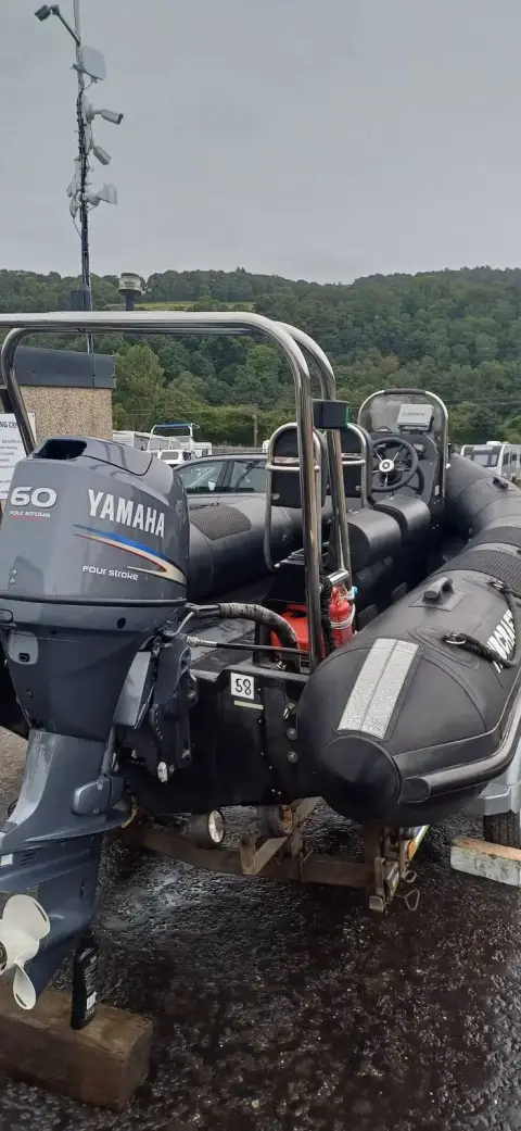 Ribcraft 5 M: stern view on trailer showing Yamaha outboard, A-frame and black Hypalon tubes