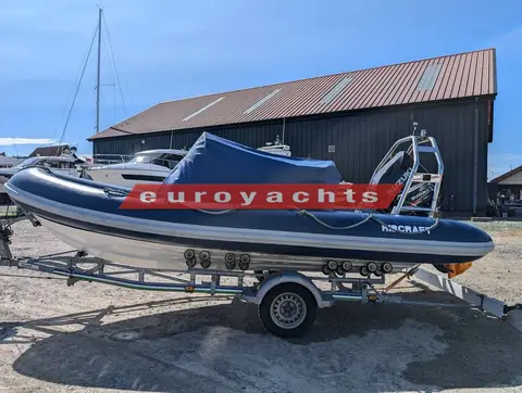 Ribcraft 585: rIB on trailer with the navy cover fitted over the console and seats