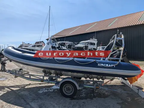 Ribcraft 585: port side of the RIB on its trailer, showing the navy tubes and A-frame