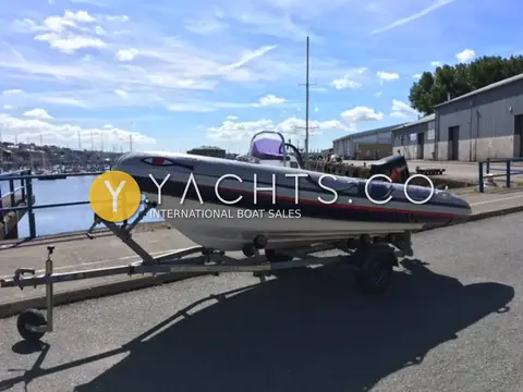 Ribeye 400: port side on trailer beside the harbour, painted eye on the bow tube