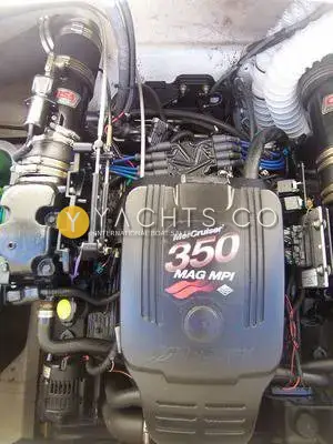 Rinker 232: engine bay showing the Mercruiser 350 MAG MPI V8 engine cover and wiring