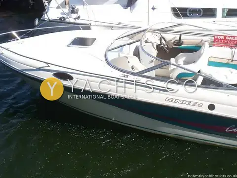 Rinker 232: port bow and windscreen with foredeck hatch and helm seats visible