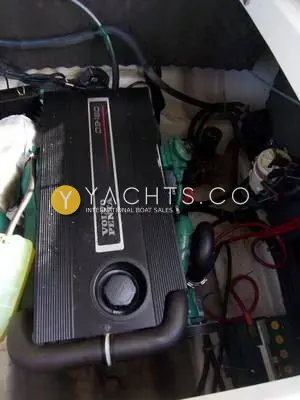 Rinker 246: engine bay showing the Volvo Penta D3-160 diesel with black engine cover and hoses