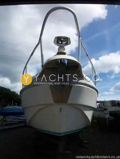 Rio 28: bow seen head-on ashore, showing anchor stowed in the stem and searchlight on rail