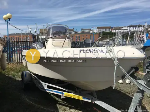 Saver 540 Open: starboard bow view of the white hull on a braked road trailer in the yard