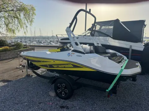Scarab 165: starboard side on trailer with marina and moored boats in the background