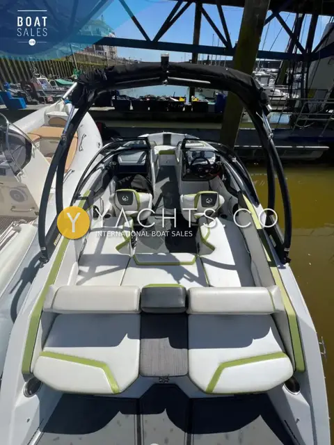 Scarab 195 ID: cockpit from the stern showing rear sun pad, bucket seats and wakeboard tower with bimini