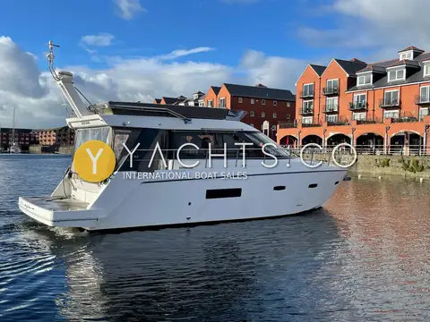 Sealine International F44: stern quarter view showing bathing platform, flybridge radar arch and cockpit enclosure