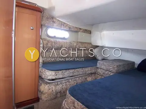 Sealine International Sealine 360 Statesman: twin cabin with two blue-cushioned berths, porthole and wooden hanging locker