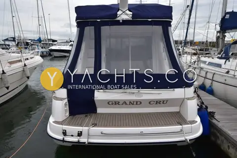 Sealine International Sealine F34: stern view with name Grand Cru on transom and dark blue cockpit canopy