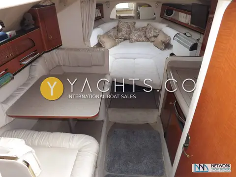 Sea Ray Sundancer 280: saloon looking aft to the stern cabin double berth, dinette table to the left