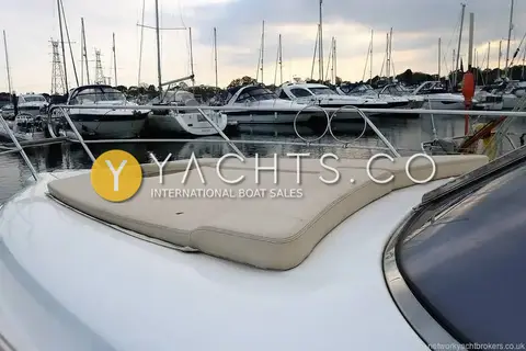Sessa Marine Sessa C30: foredeck sunpad cushion with marina berths and moored boats beyond