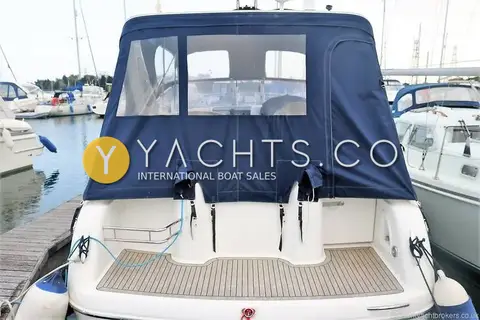 Sessa Marine Sessa C30: stern view with teak bathing platform and navy cockpit canopy closed