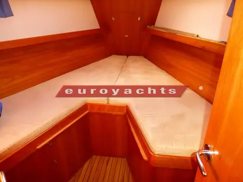 Southerly 38: forward cabin V berths with wood-panelled sides and cream cushions