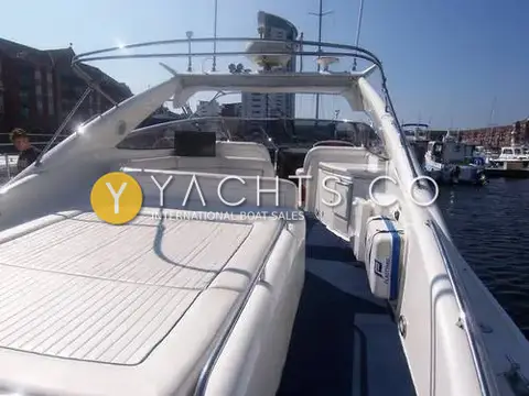 Sunseeker Camargue 47: aft sunpad and cockpit seating looking forward to the arch, Plastimo liferaft to starboard