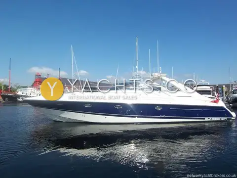 Sunseeker Camargue 47: starboard profile afloat in Swansea marina, Oxford blue hull with red lightship behind