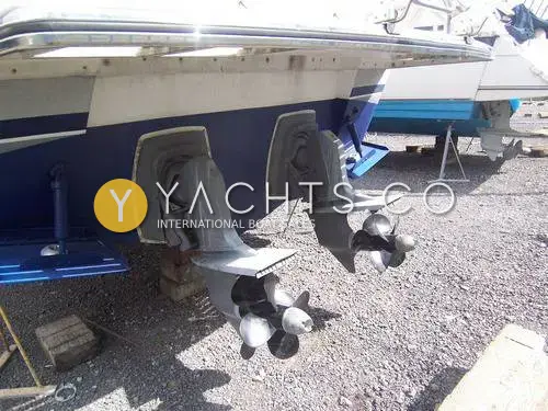 Sunseeker Martinique 36: transom underside ashore showing twin outdrive legs with counter-rotating duoprop propellers, blue hull