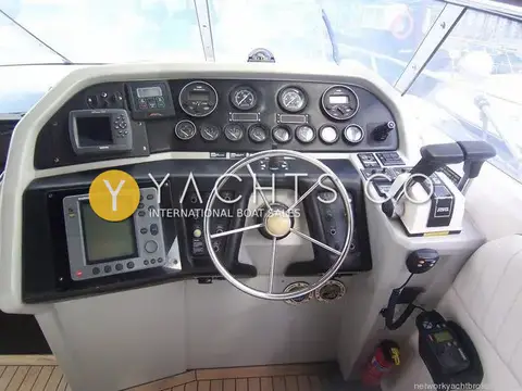 Sunseeker Martinique 36: helm station under windscreen with plotter, engine gauges and twin lever throttles