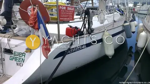 Taswell 49CC: port quarter in marina showing hull name stripe, fenders, lifebuoy and for sale sign