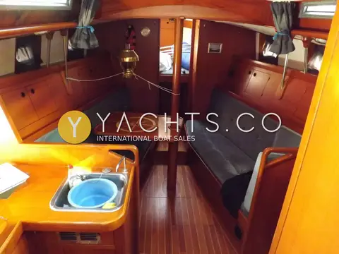 Van Waveren 33 van Waveren: saloon looking forward past galley sink to settees and inlaid table