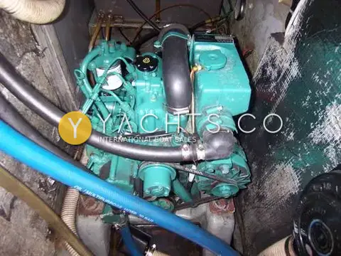 Westerly Fulmar 33: engine bay showing the green Volvo Penta diesel with surrounding hoses