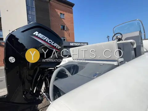 Zodiac Medline 580 Rib: mercury outboard on the transom beside the helm seat and steering wheel