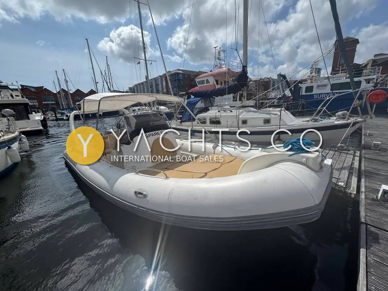 Zodiac Medline III Rib: grey-tubed RIB moored in a marina berth with teak-effect deck and tan seating
