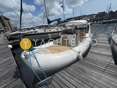 Zodiac Medline III Rib: bow view of the RIB alongside a wooden pontoon with bow cushions and radar arch