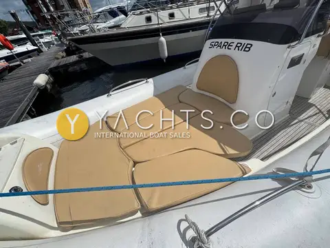 Zodiac Medline III Rib: bow sunpad with tan filler cushions laid out in front of the console
