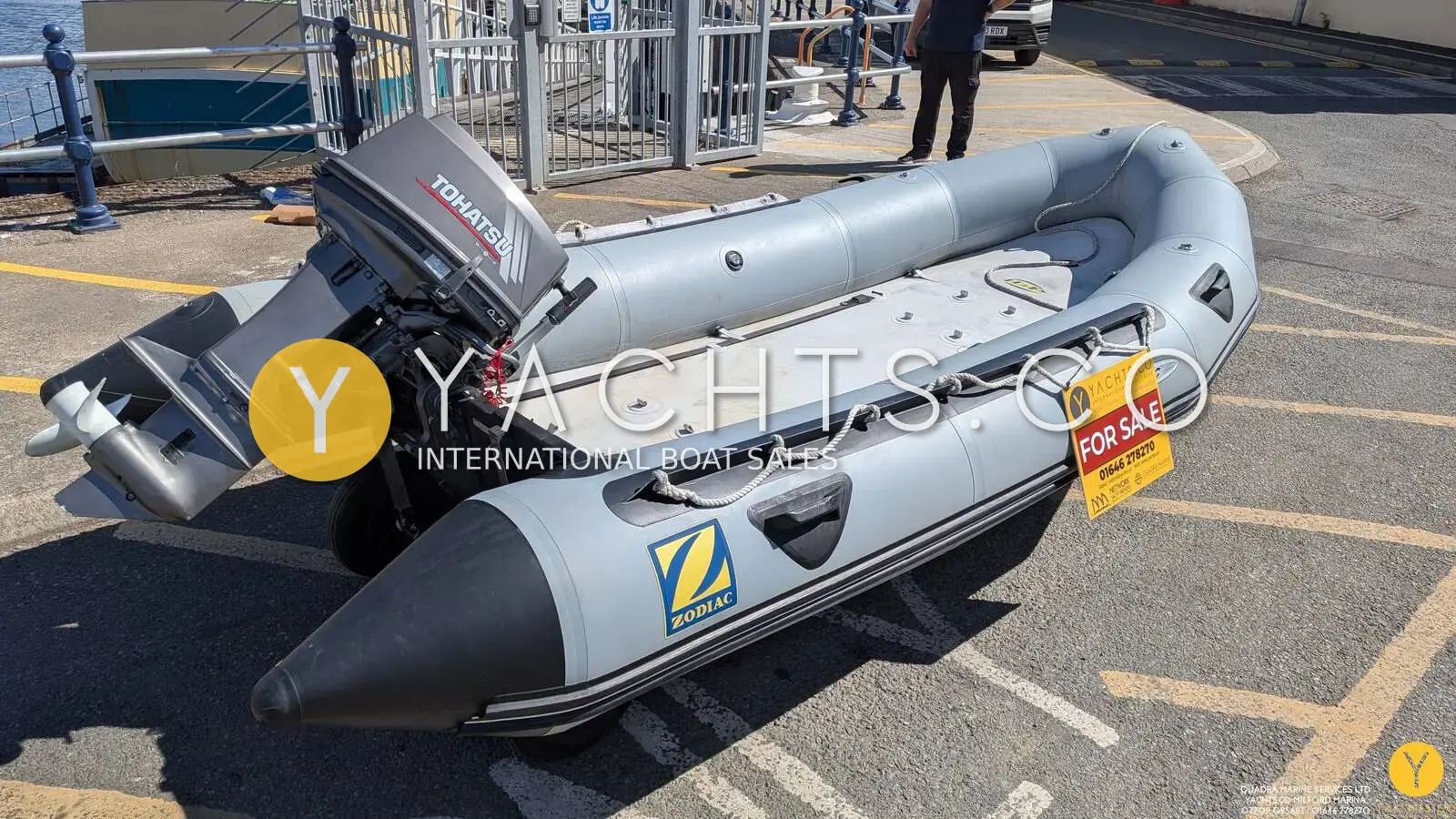 Zodiac Mk 2 Classic Sib Airdeck: grey inflatable with outboard on transom, airdeck floor visible, on a marina quayside